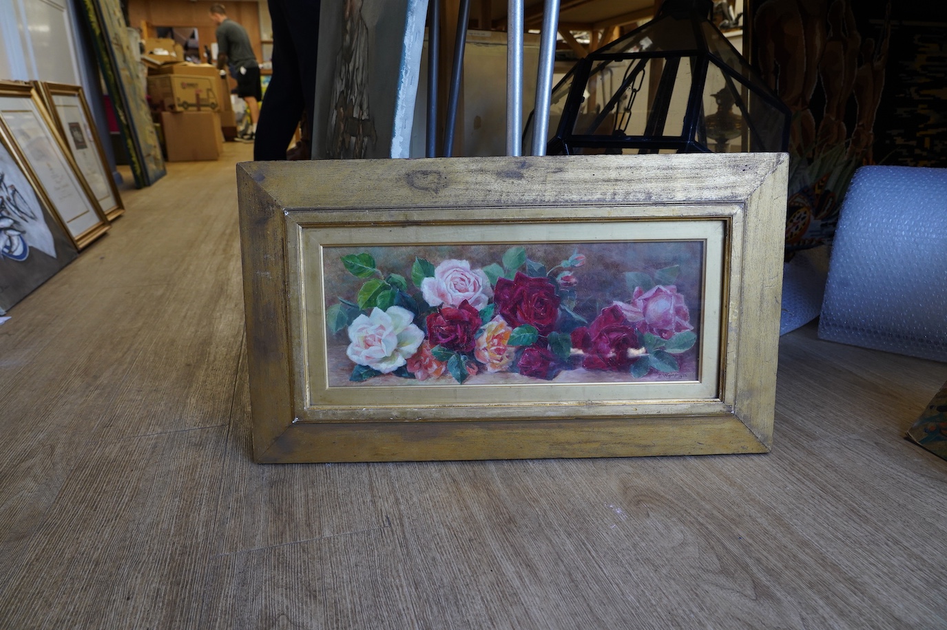 Edith Wigley, oil on canvas, Still life of roses, signed and dated 1902, 16.5 x 44cm, gilt framed. Condition - fair to good